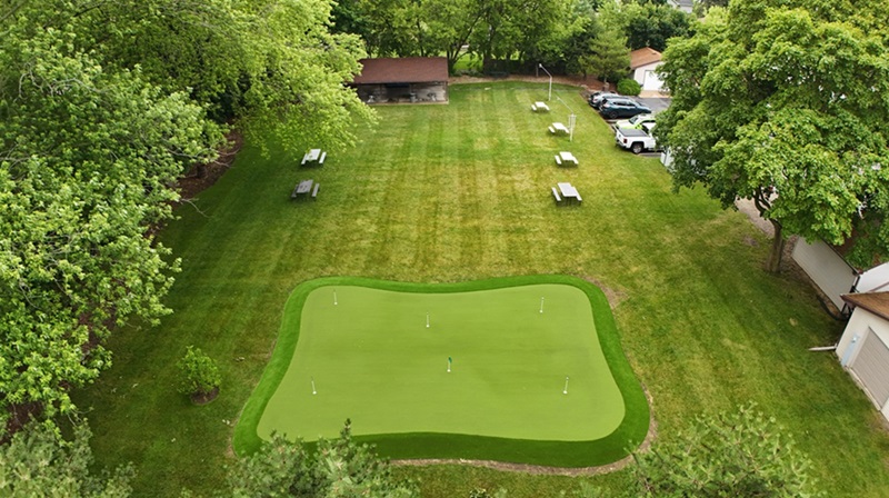 Synthetic putting green installed at a beer garden bar and restaurant in Kenosha, WI. Lots of fun and games to be had with its 6 differing cups and various undulations.