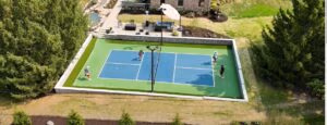 Professional pickleball court installation in Milwaukee WI with premium sports surface, lighting, and retaining wall.