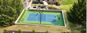 Professional pickleball court installation in Milwaukee WI with premium sports surface, lighting, and retaining wall.