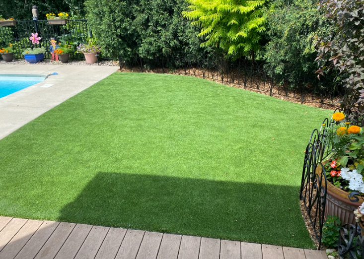 Luxury artificial pet turf installation by Premier Turf & Greens in a high-end Milwaukee backyard, perfect for pets and outdoor entertaining.